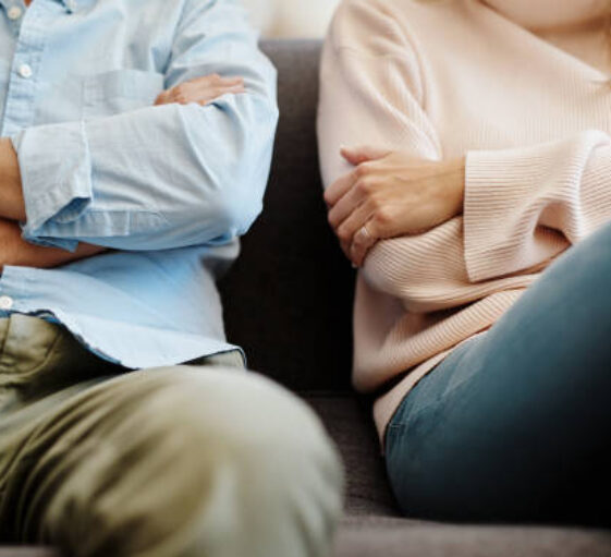 Cropped shot of a couple having a disagreement at home